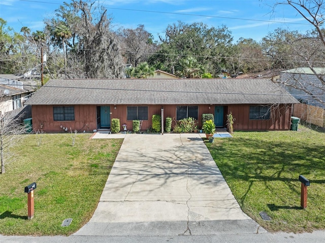 ranch-style home with a front yard