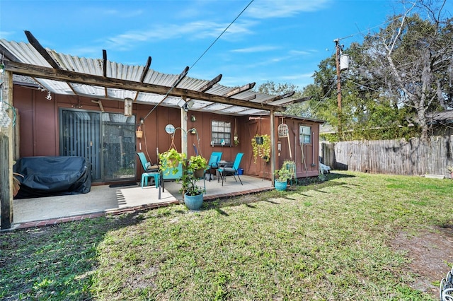 exterior space with a patio and a lawn