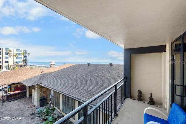 balcony with a view of the beach and a water view