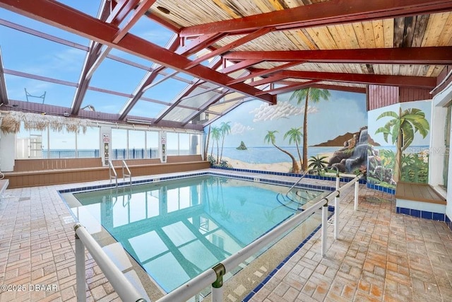 view of swimming pool featuring a water view and a patio area