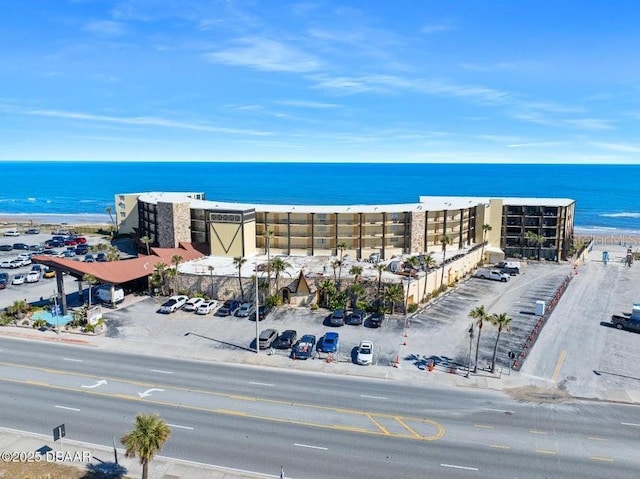 aerial view with a view of the beach and a water view