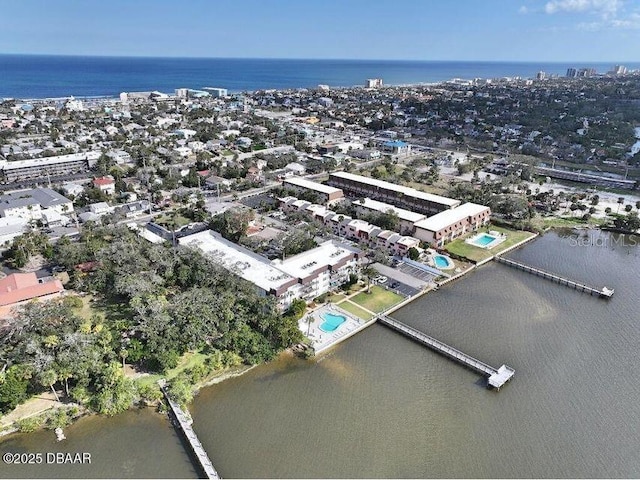 birds eye view of property featuring a water view