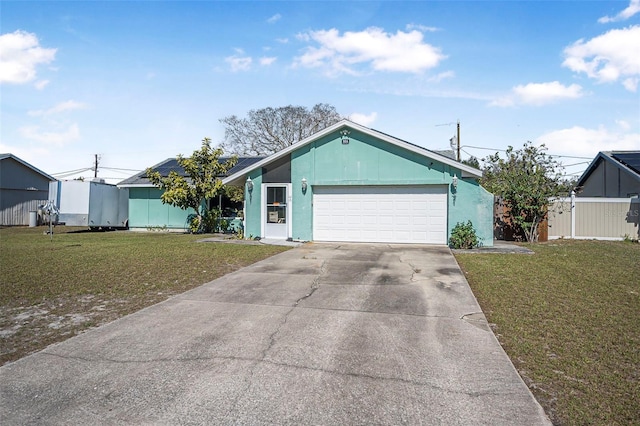 ranch-style home with a front lawn and a garage