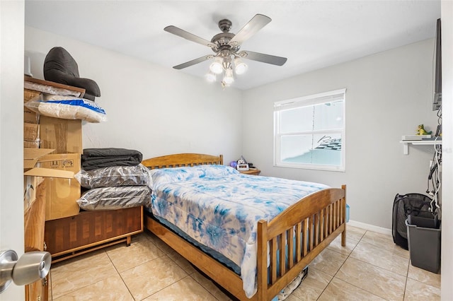 bedroom featuring light tile patterned flooring and ceiling fan