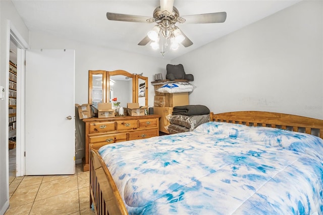 tiled bedroom with ceiling fan