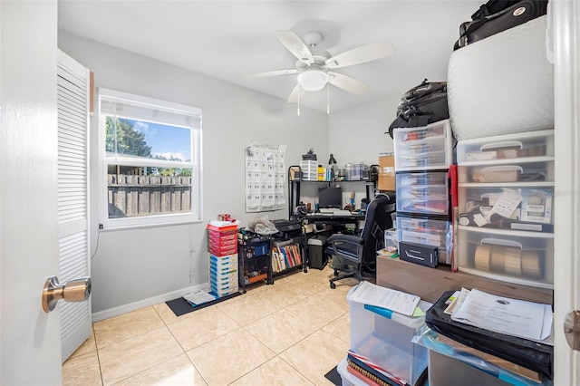 office featuring light tile patterned floors and ceiling fan