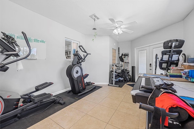 workout area featuring ceiling fan, tile patterned flooring, and french doors