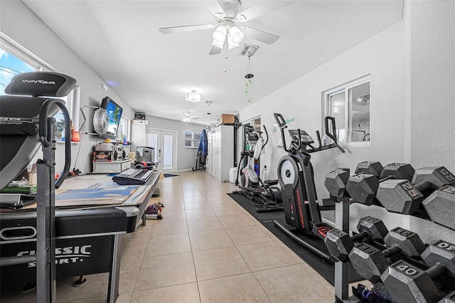 gym with ceiling fan and tile patterned flooring