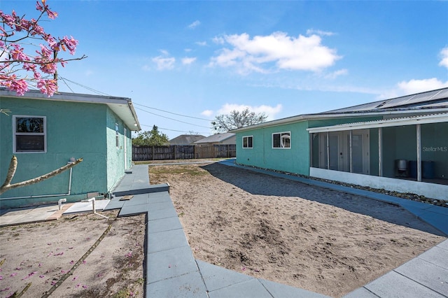 view of yard with a sunroom