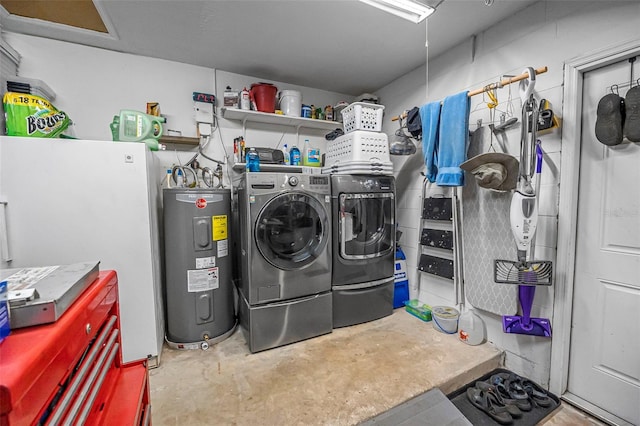 washroom featuring washing machine and dryer and water heater