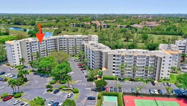 birds eye view of property with a water view