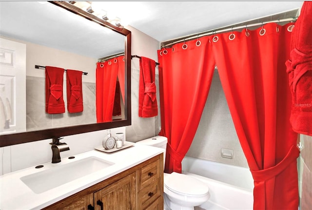 full bath with vanity, toilet, and shower / bath combo with shower curtain