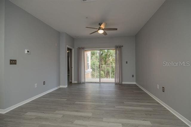 unfurnished room featuring ceiling fan and light hardwood / wood-style floors