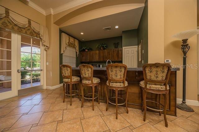 bar featuring crown molding