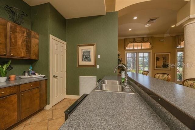 kitchen with sink and decorative columns