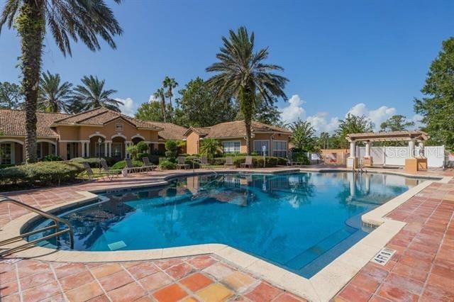 view of swimming pool featuring a patio and a pergola