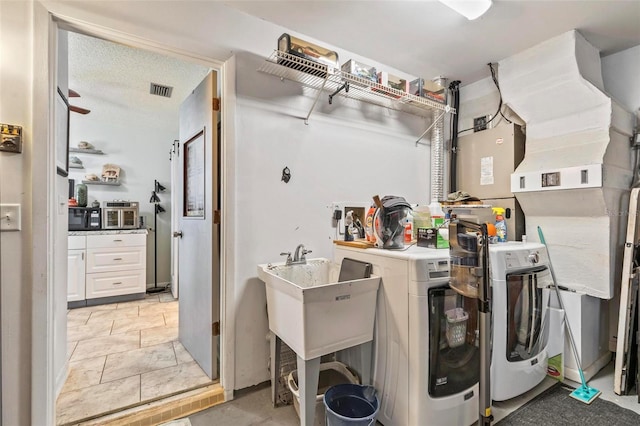 washroom featuring washer and clothes dryer