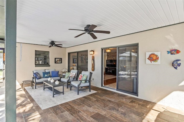 view of patio / terrace with ceiling fan and outdoor lounge area