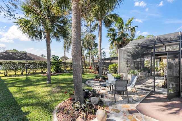 view of yard featuring a lanai and a patio area