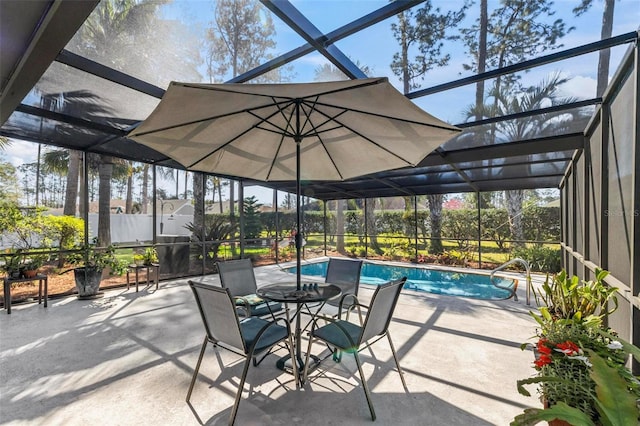 view of patio featuring glass enclosure