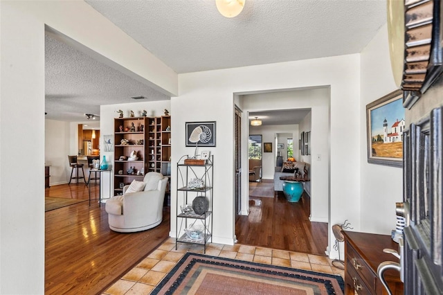 12 Bannerwood Ln, Palm Coast, FL 32137 - entrance foyer featuring light tile patterned flooring and a textured ceiling