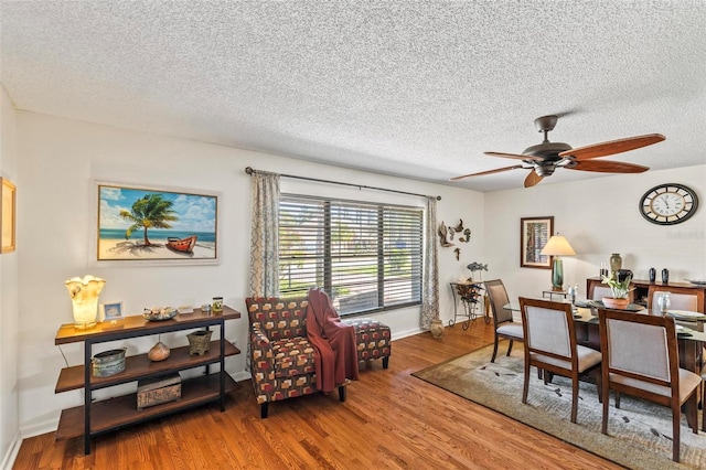 12 Bannerwood Ln, Palm Coast, FL 32137 - dining area with wood finished floors, ceiling fan, and a textured ceiling