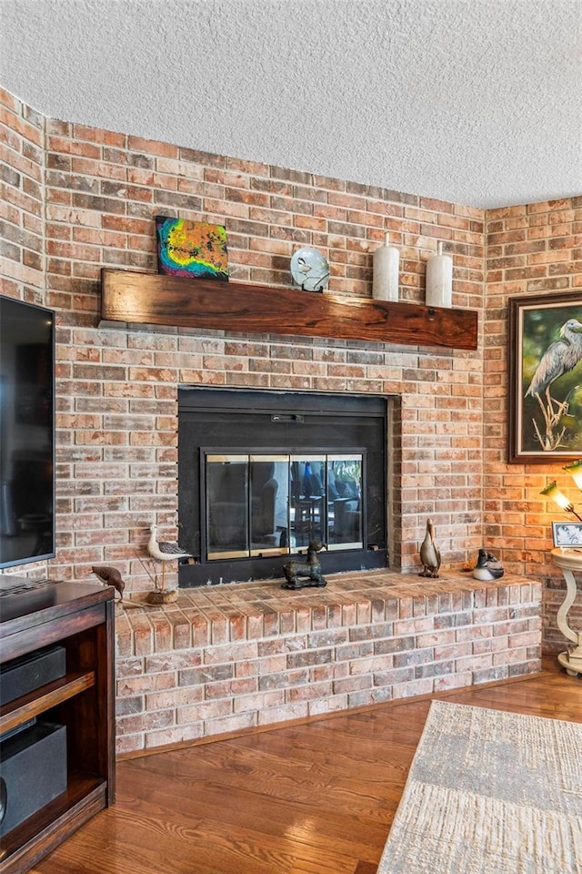12 Bannerwood Ln, Palm Coast, FL 32137 - detailed view of a textured ceiling, a fireplace, and wood finished floors