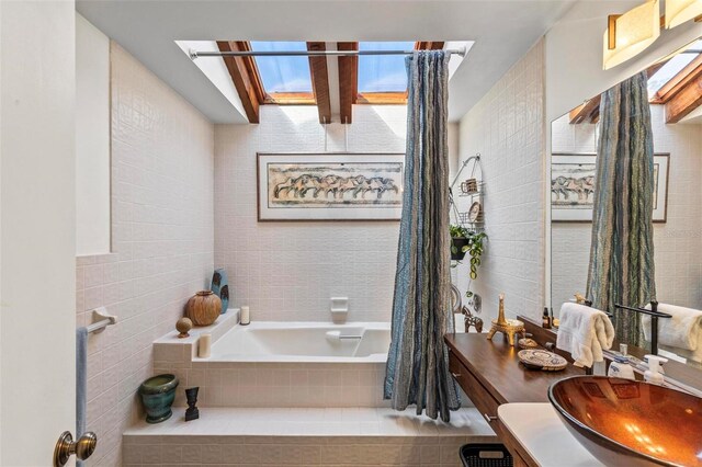 12 Bannerwood Ln, Palm Coast, FL 32137 - bathroom featuring tile walls, tiled bath, vanity, and beamed ceiling