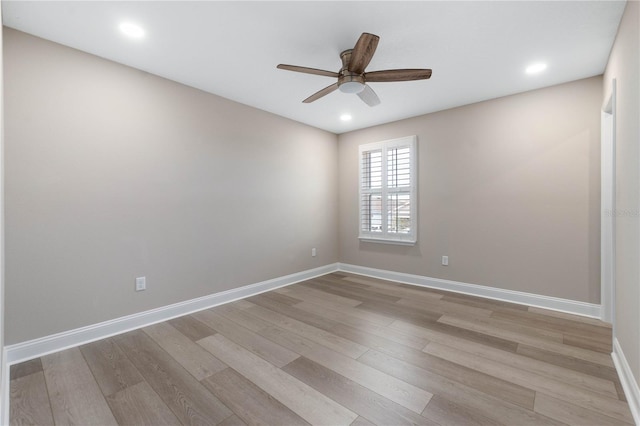 empty room with light wood-type flooring, ceiling fan, baseboards, and recessed lighting