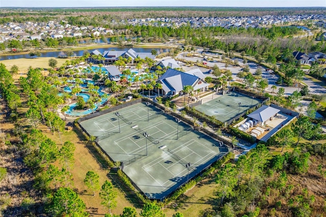 birds eye view of property with a water view and a residential view