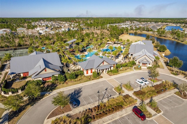 drone / aerial view with a residential view and a water view