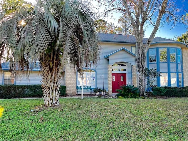 view of front of property with a front lawn