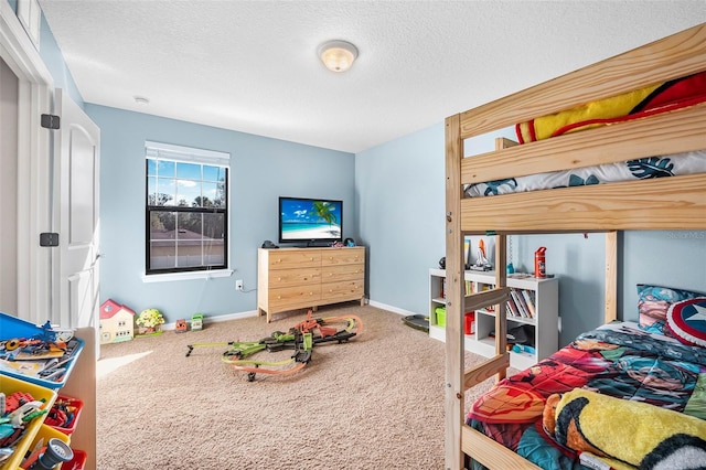 bedroom with carpet and a textured ceiling