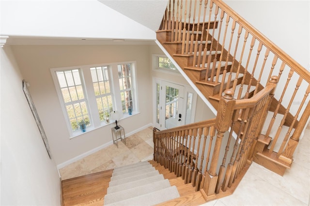 stairway with lofted ceiling