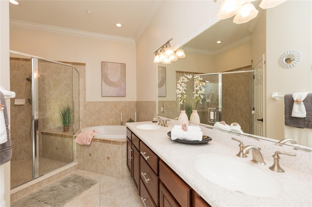 bathroom with ornamental molding, separate shower and tub, tile patterned floors, and vanity