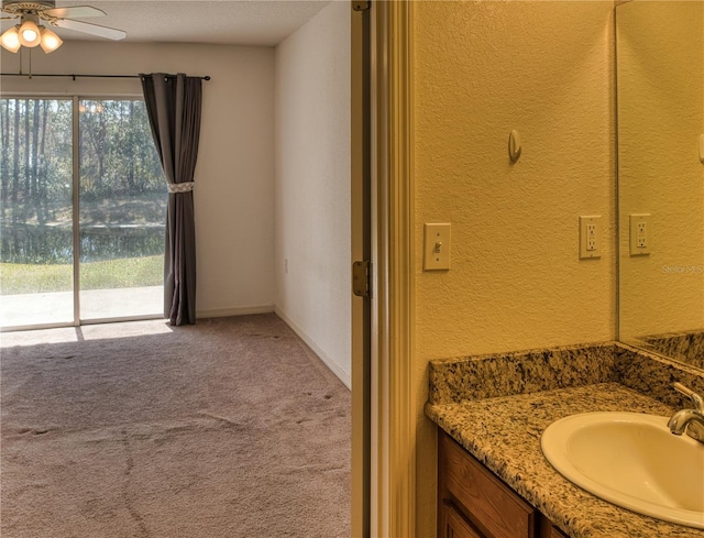 bathroom with vanity and ceiling fan