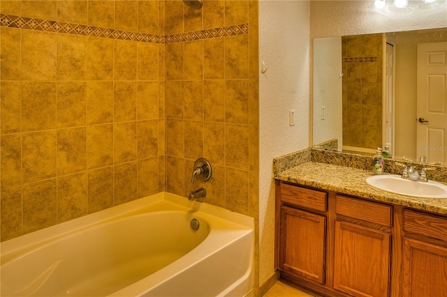 bathroom featuring vanity and tub / shower combination