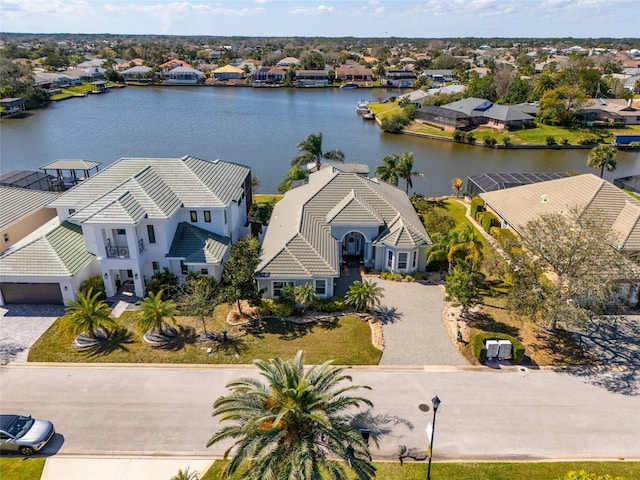 birds eye view of property featuring a water view and a residential view