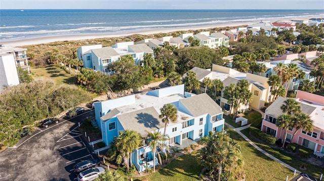 bird's eye view featuring a water view, a residential view, and a beach view