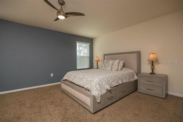 carpeted bedroom with ceiling fan