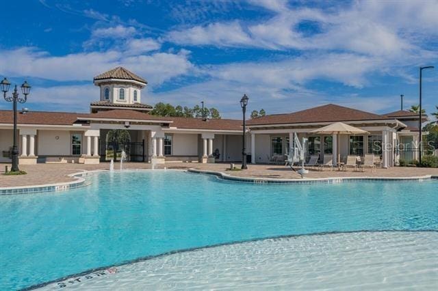 view of pool featuring a patio area