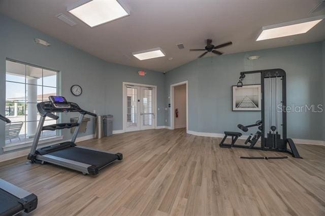 exercise area featuring wood-type flooring and ceiling fan