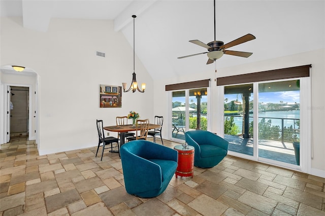 interior space with ceiling fan, beam ceiling, and high vaulted ceiling