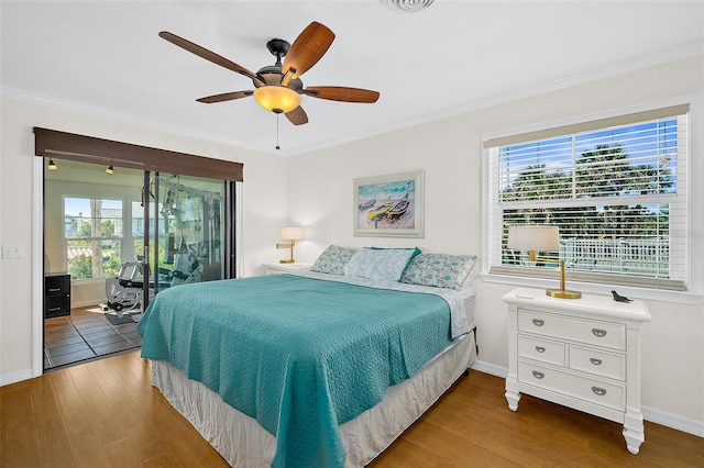 bedroom with wood-type flooring, ceiling fan, access to exterior, and crown molding