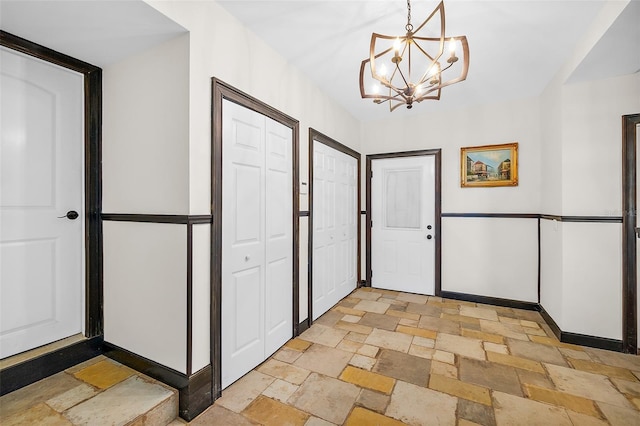 entryway featuring an inviting chandelier