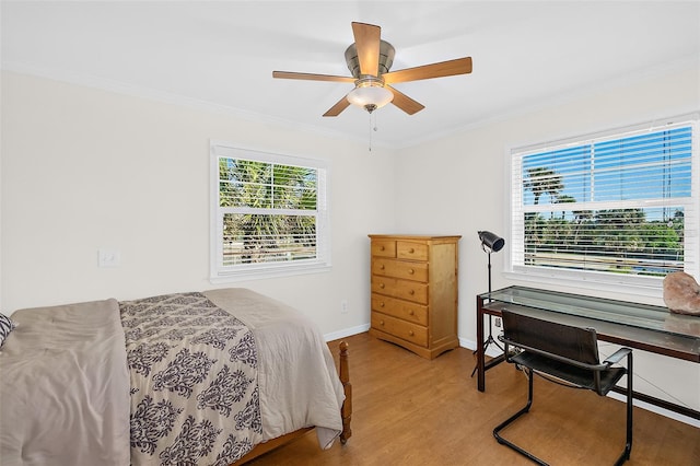 bedroom with crown molding, ceiling fan, and light wood-type flooring