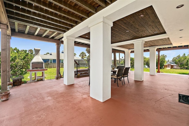 view of patio featuring a fireplace