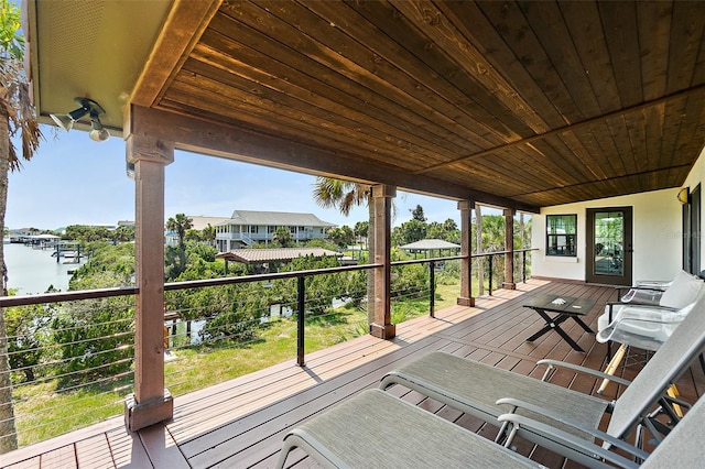 wooden deck featuring a water view