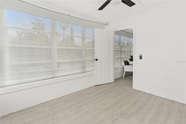 empty room featuring light hardwood / wood-style flooring and ceiling fan