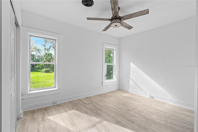 unfurnished room featuring ceiling fan and light hardwood / wood-style floors